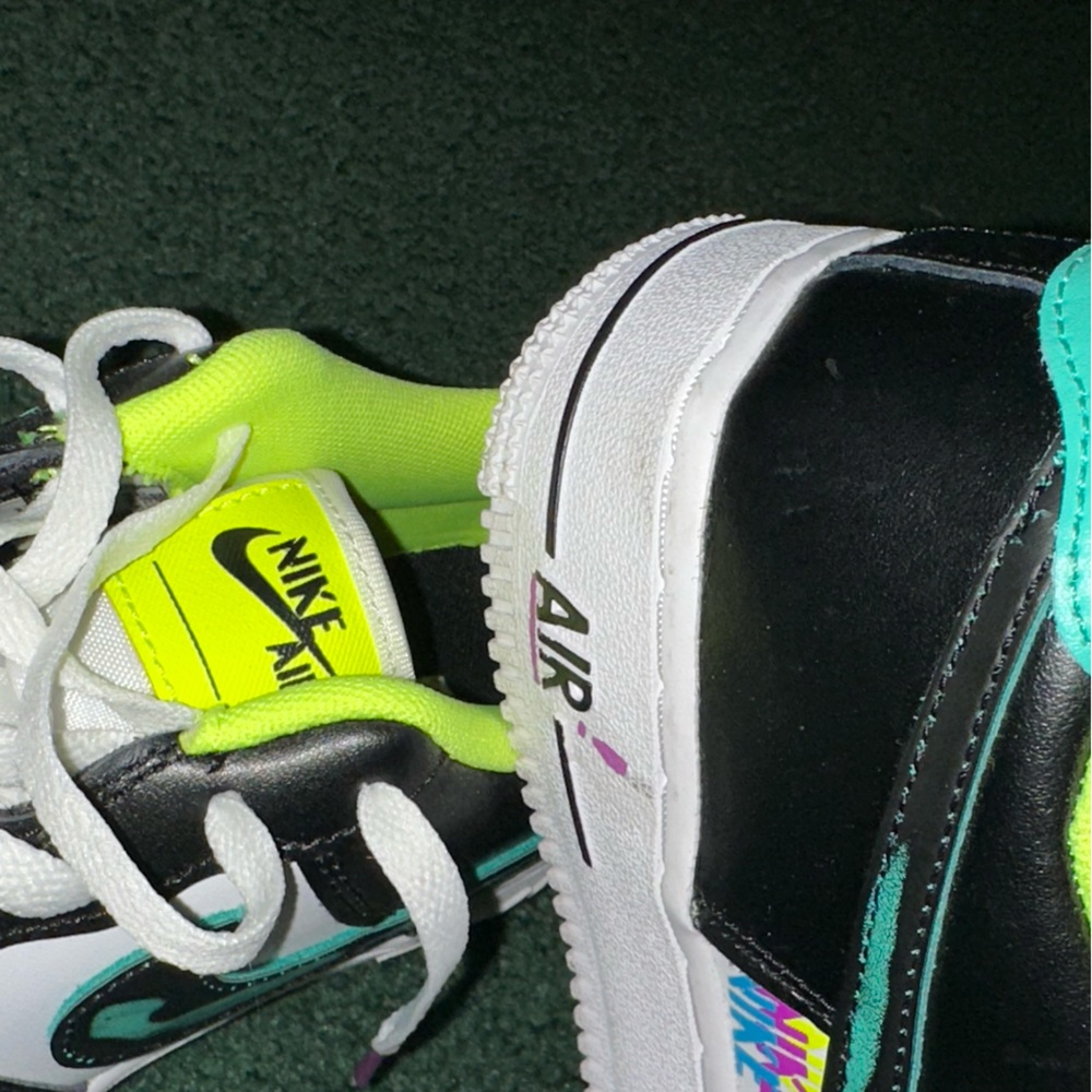 Air Force ones ( bold yellowish lime color, black , white hint of blue & purple)
